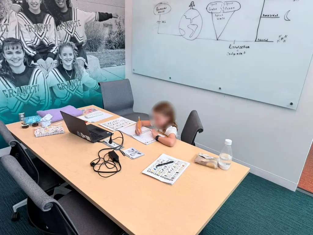 Young student writing Spanish vocabulary during class